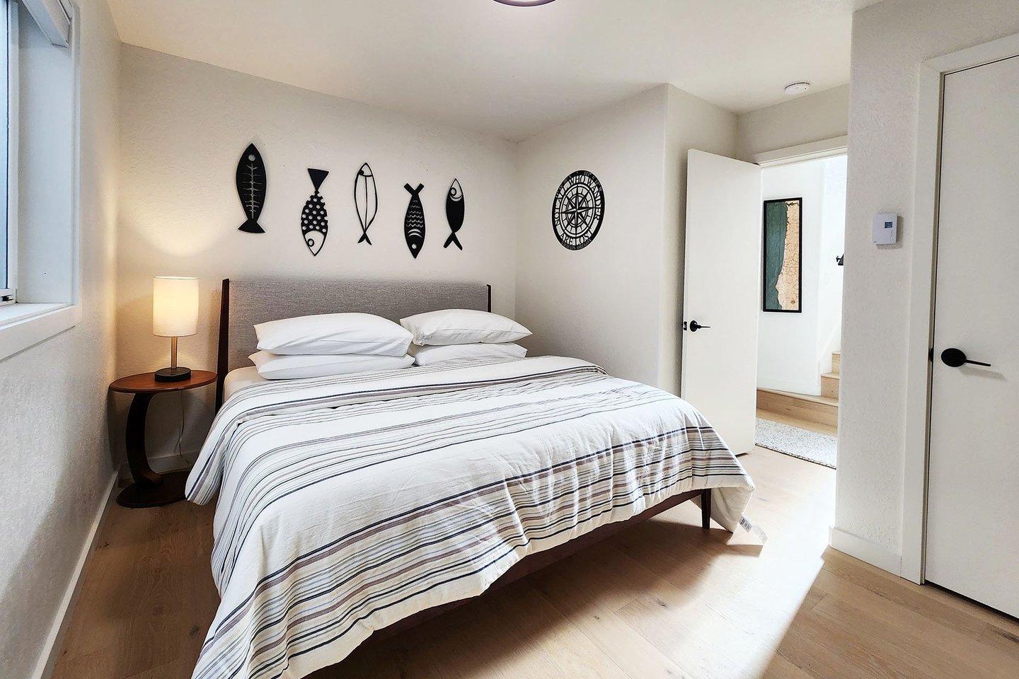 Downstairs bedroom with a comfy king bed.