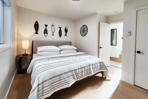 Downstairs bedroom with a comfy king bed.