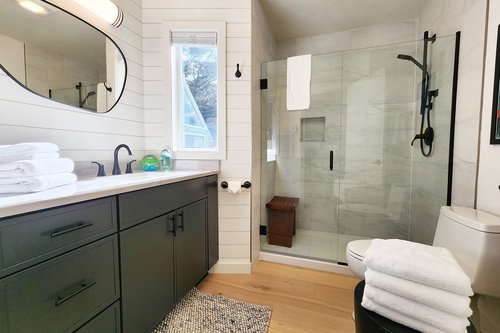 Second bath downstairs with another spa-like tiled shower.