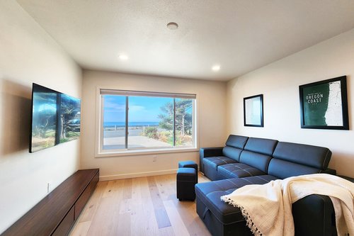 Sitting area includes a queen sleeper pull out and television.