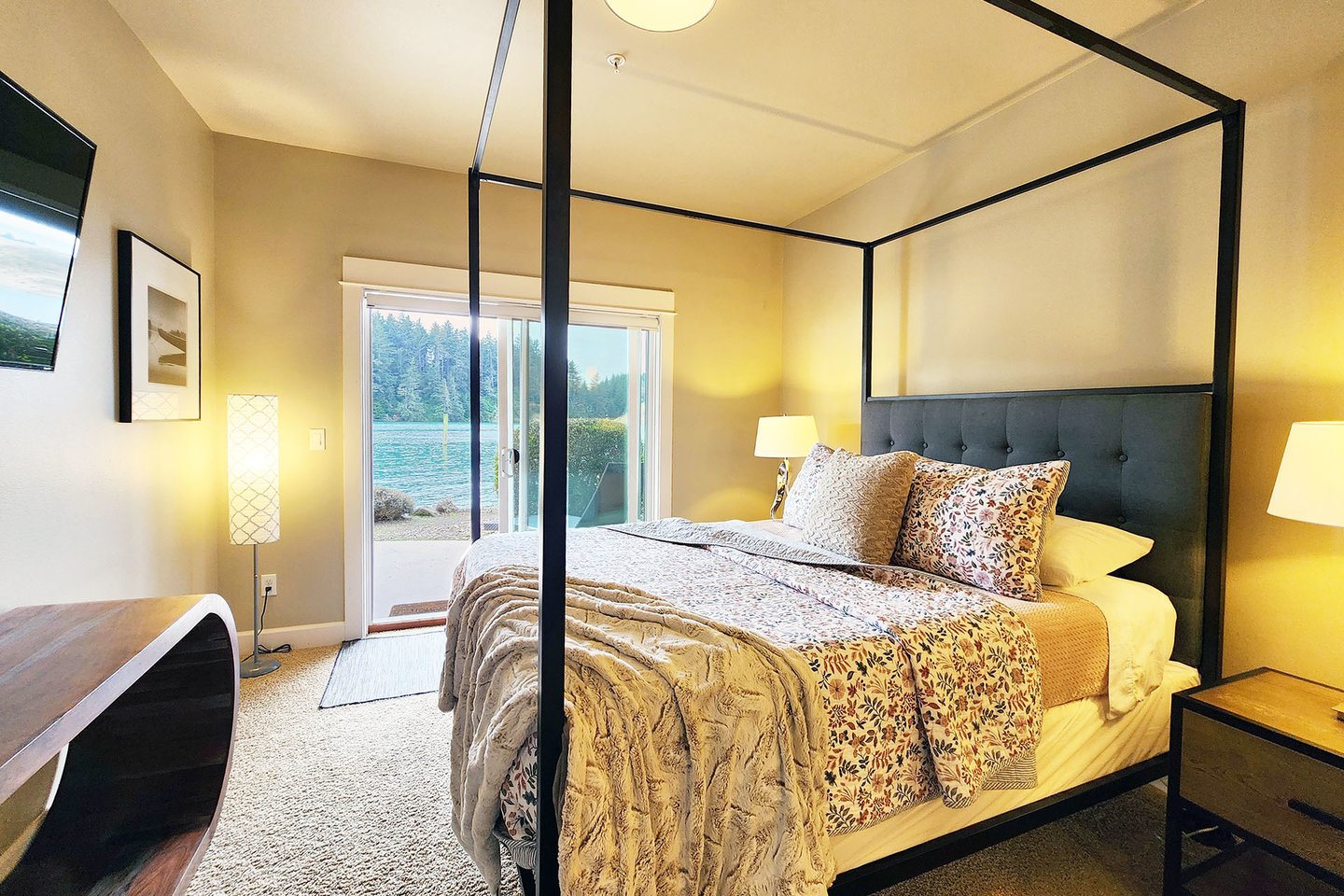 Primary suite with door to patio and river views,