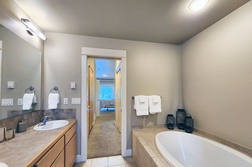 Large ensuite with tub and shower.