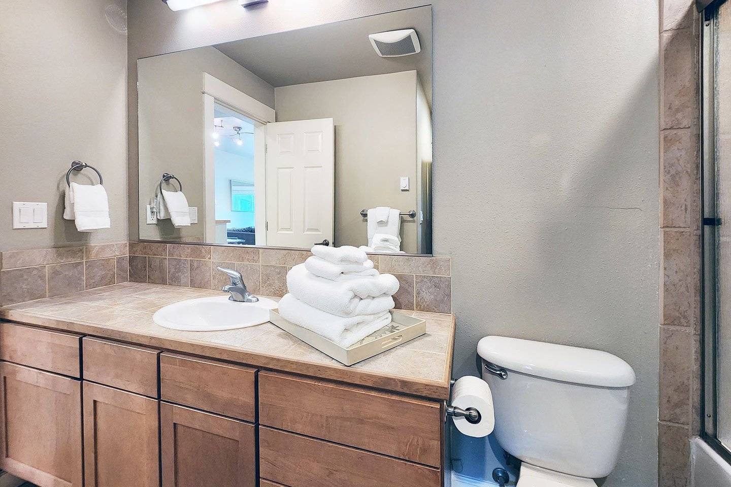 Second bathroom has access from the bedroom or hallway.