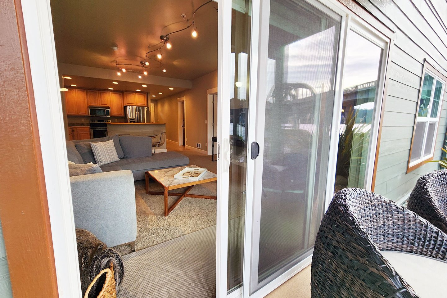 The living room opens to a nice patio to sit and watch the river.