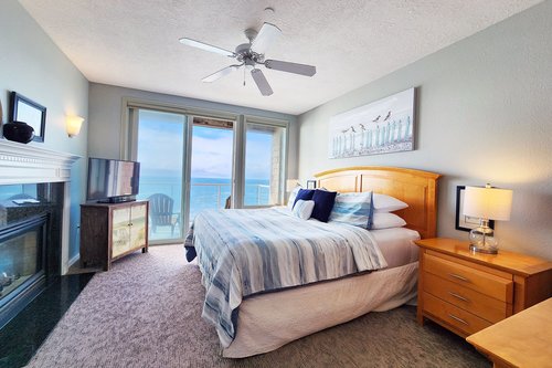 Primary bedroom with balcony