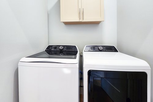 A laundry room for convenience.