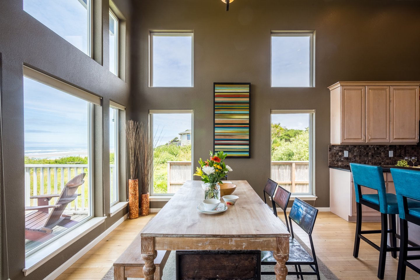 Floor to ceiling windows and ocean front view in the downstairs great room.
