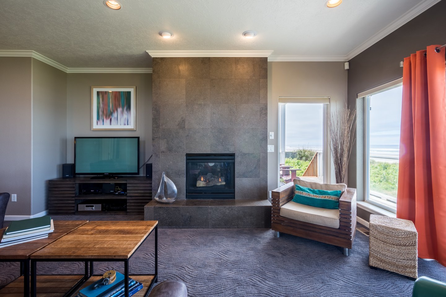 The home has a gas fireplace, and modern furnishings.