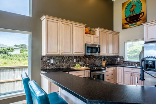 An open floor plan and ocean front view in the downstairs great room.