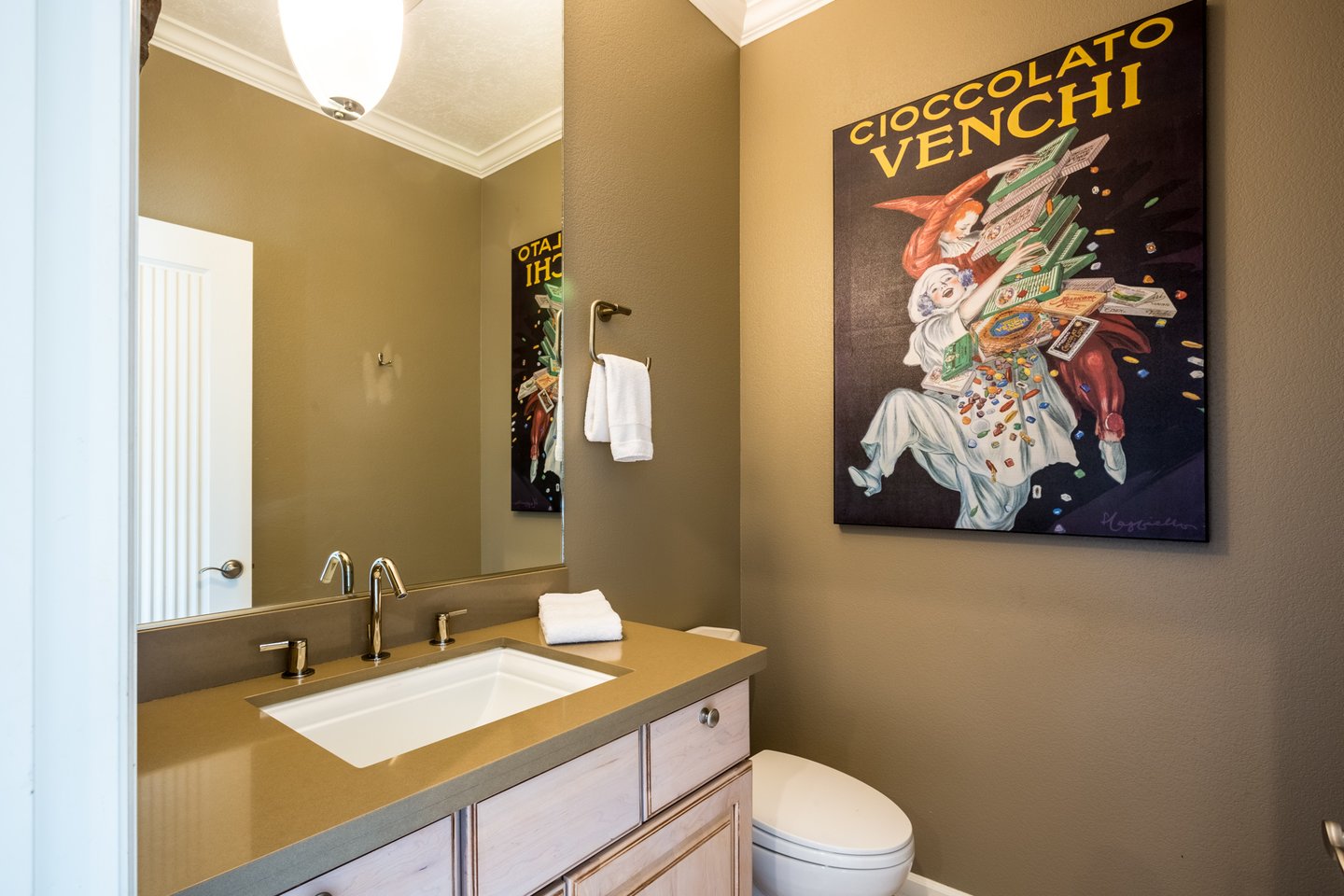 The half bath upstairs in the upstairs den.