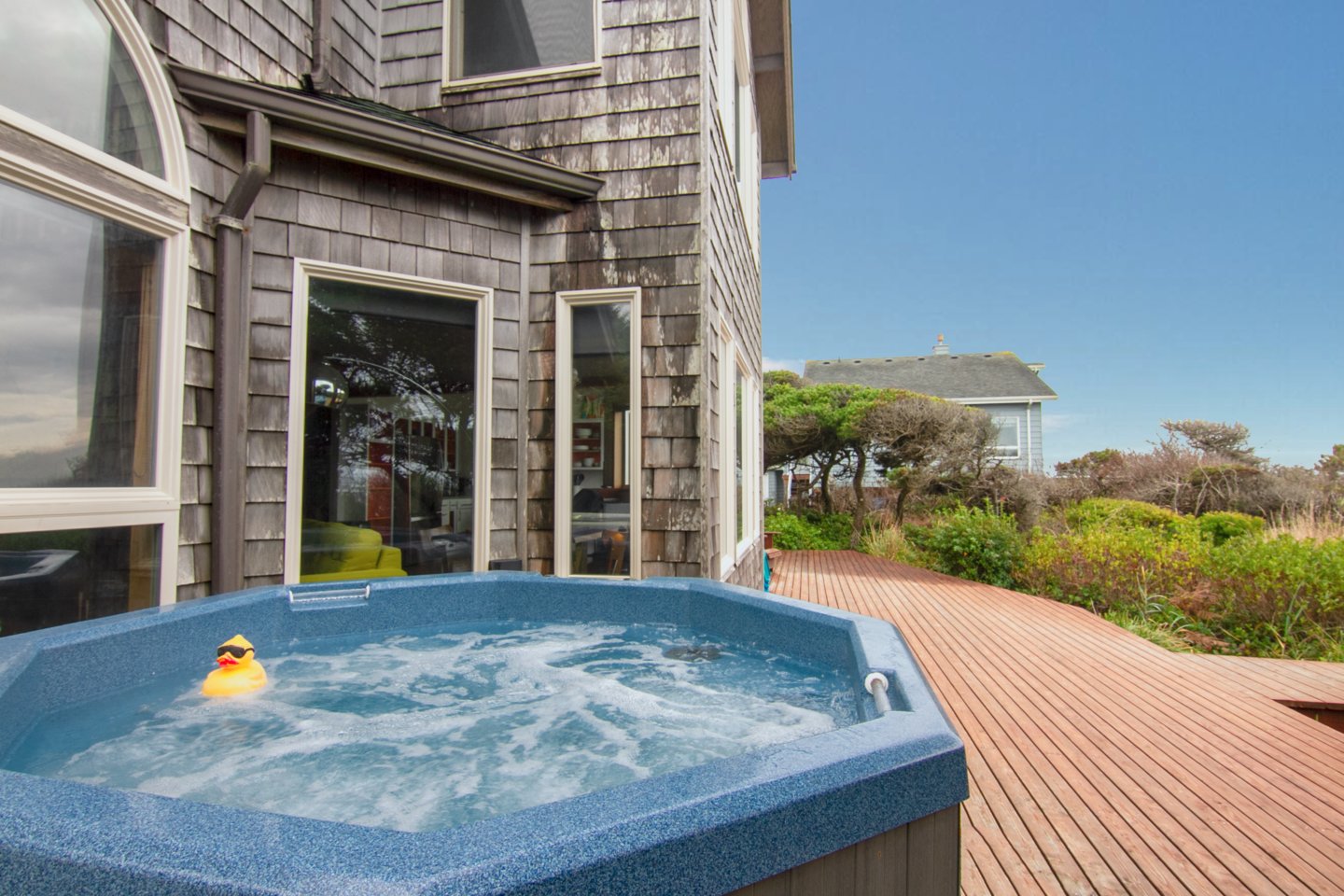 Relax in the ocean view private hot tub - a sea-side luxury.