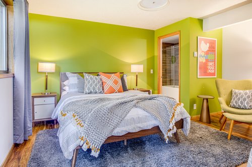 Colorful decor in the main floor bedroom.