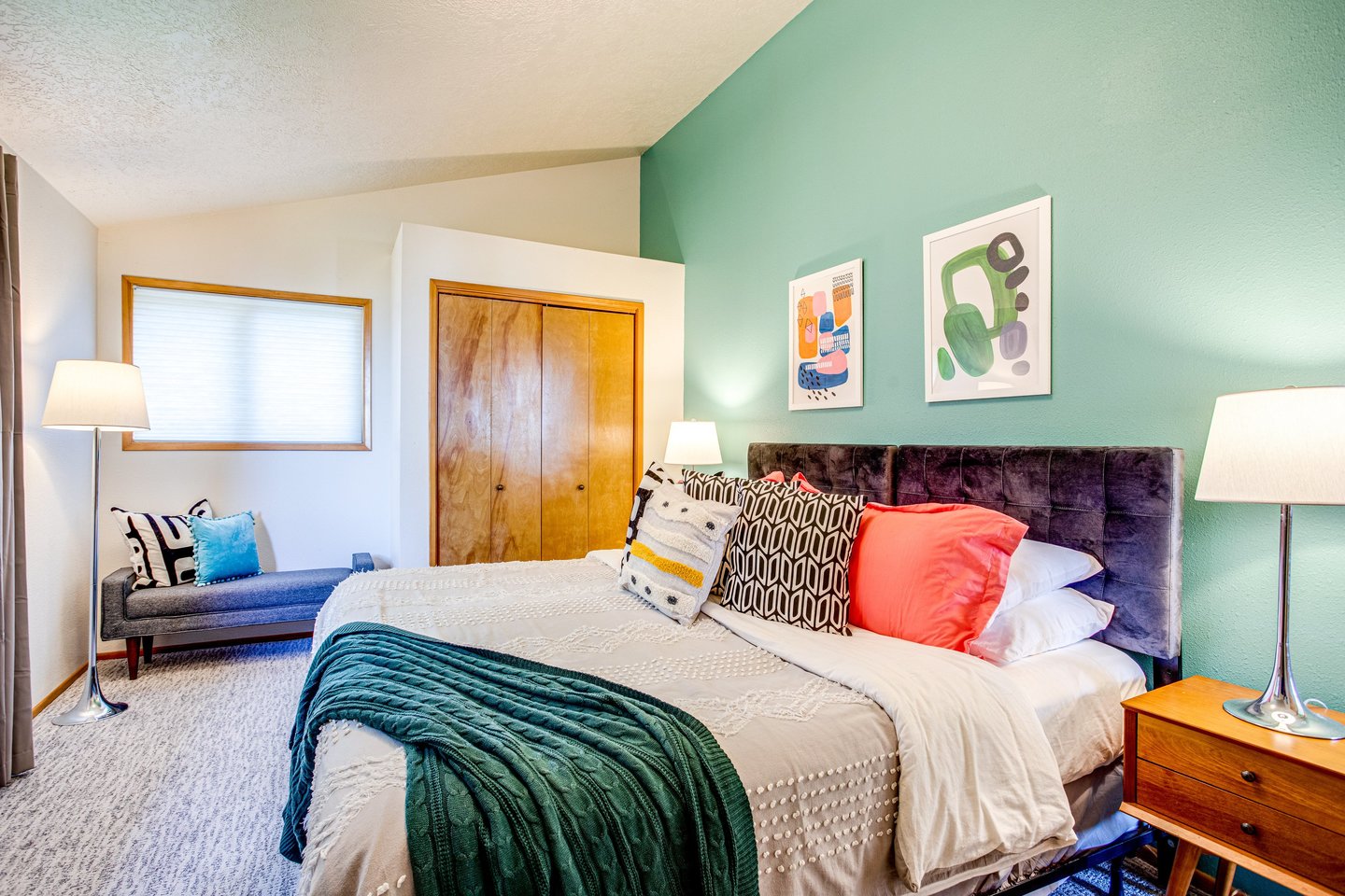 The primary bedroom is a picture of comfort, with a modern, inviting design.