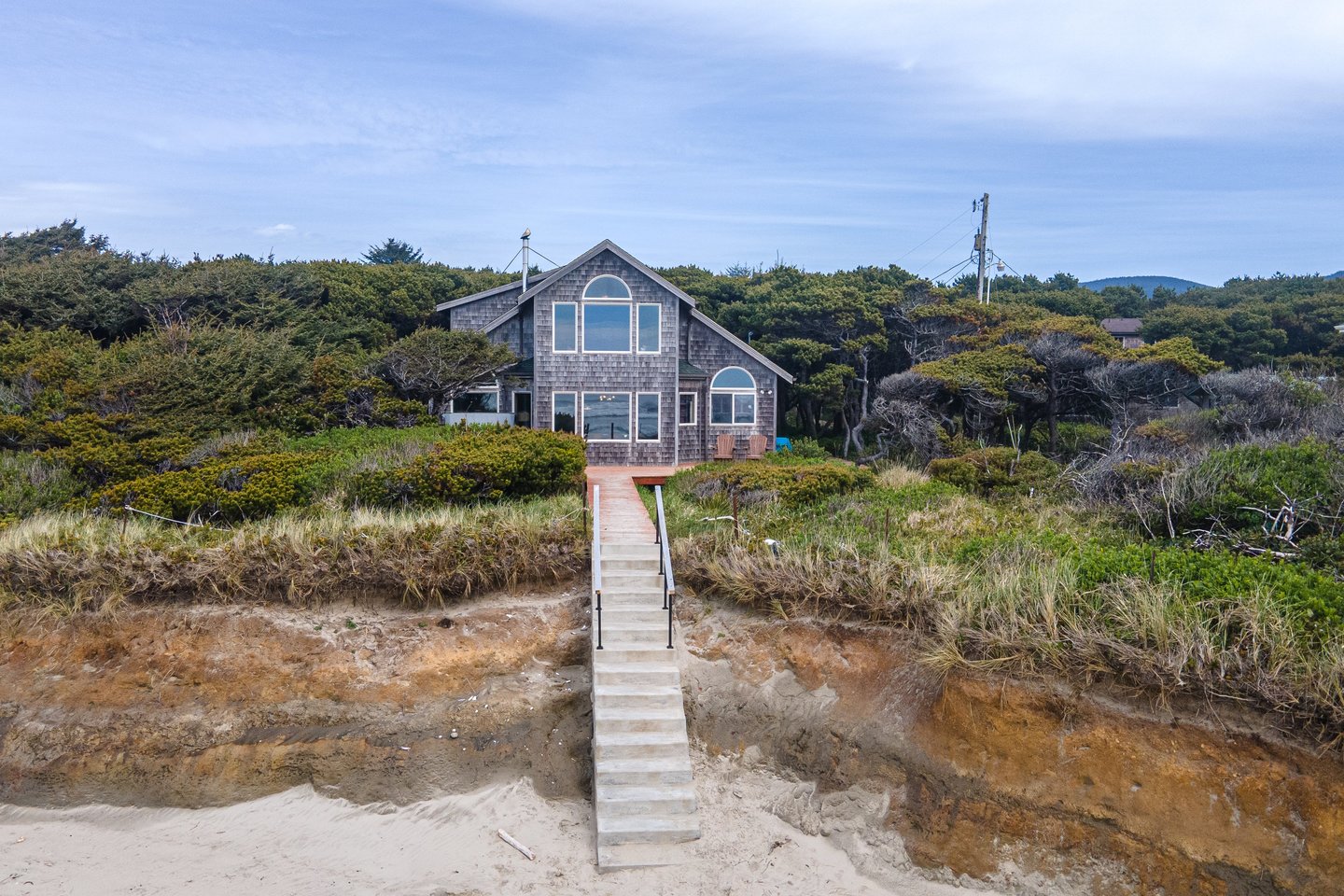 Private beach access down concrete steps to miles of sandy beach.