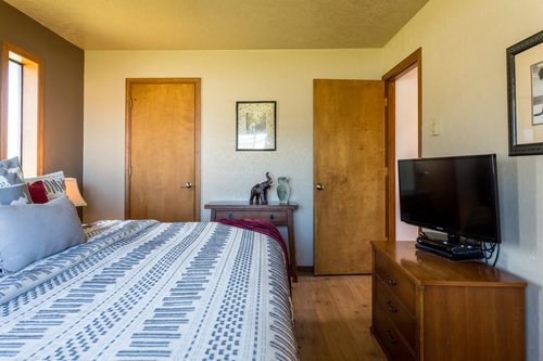 Watch some late night television from the comfort of your bed.