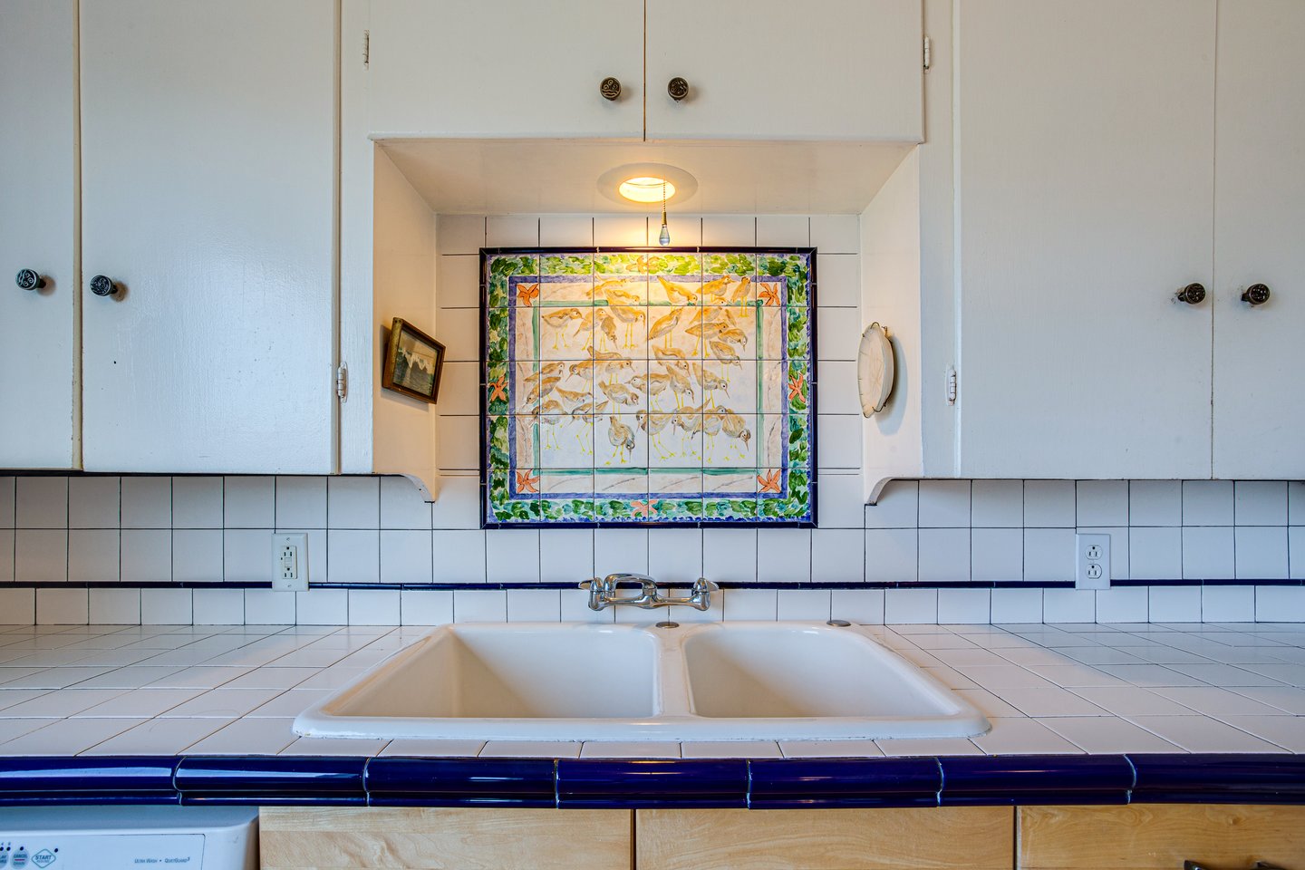 Quaint cabinetry and counters in the kitchen