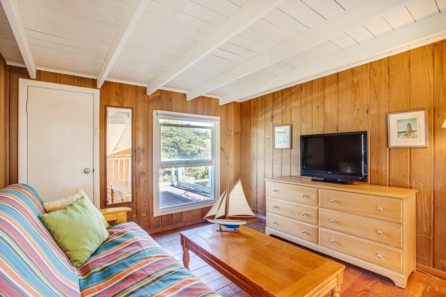 The television is upstairs with a futon for added sleeping.
