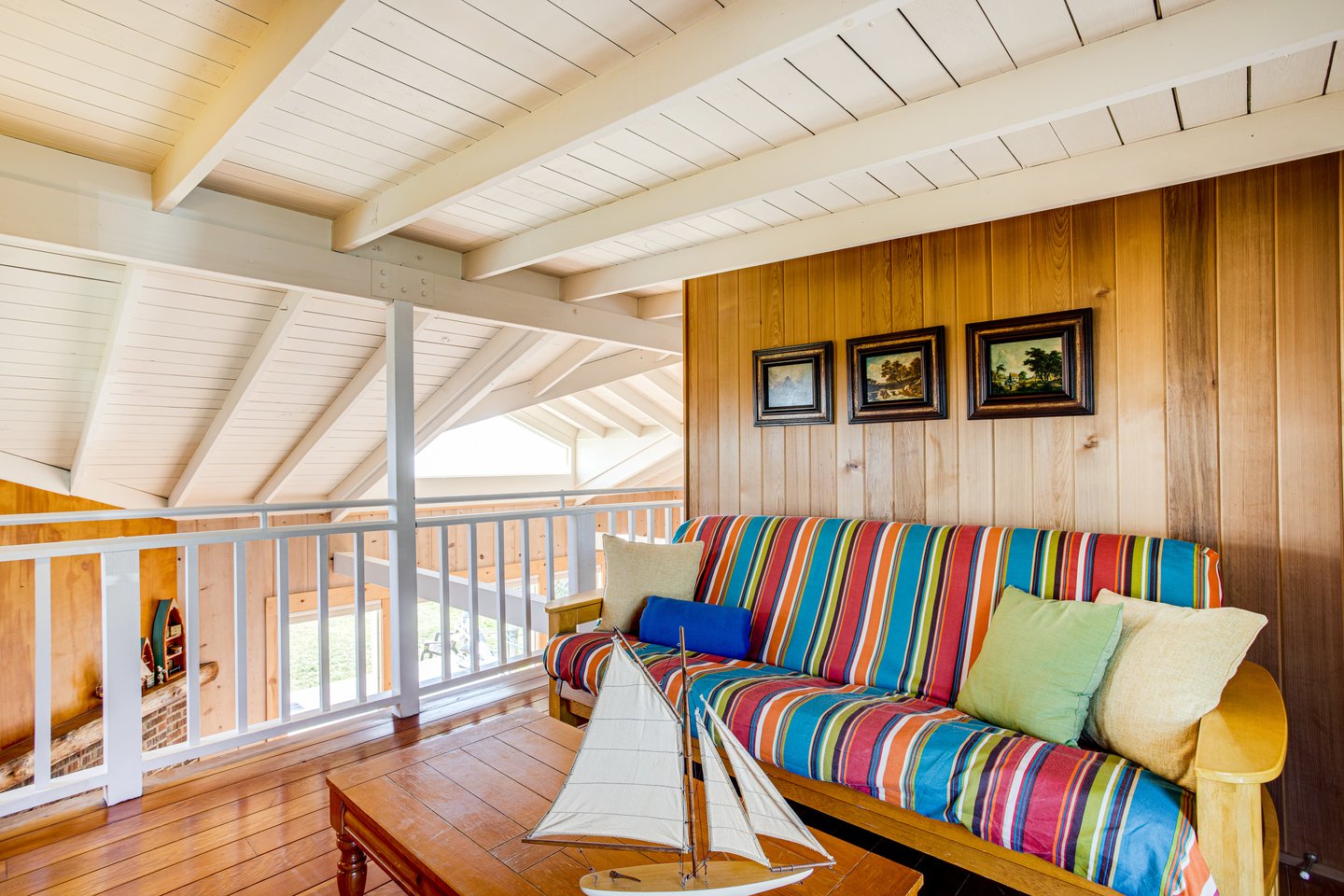 The colorful futon adds extra seating in the upstairs loft.