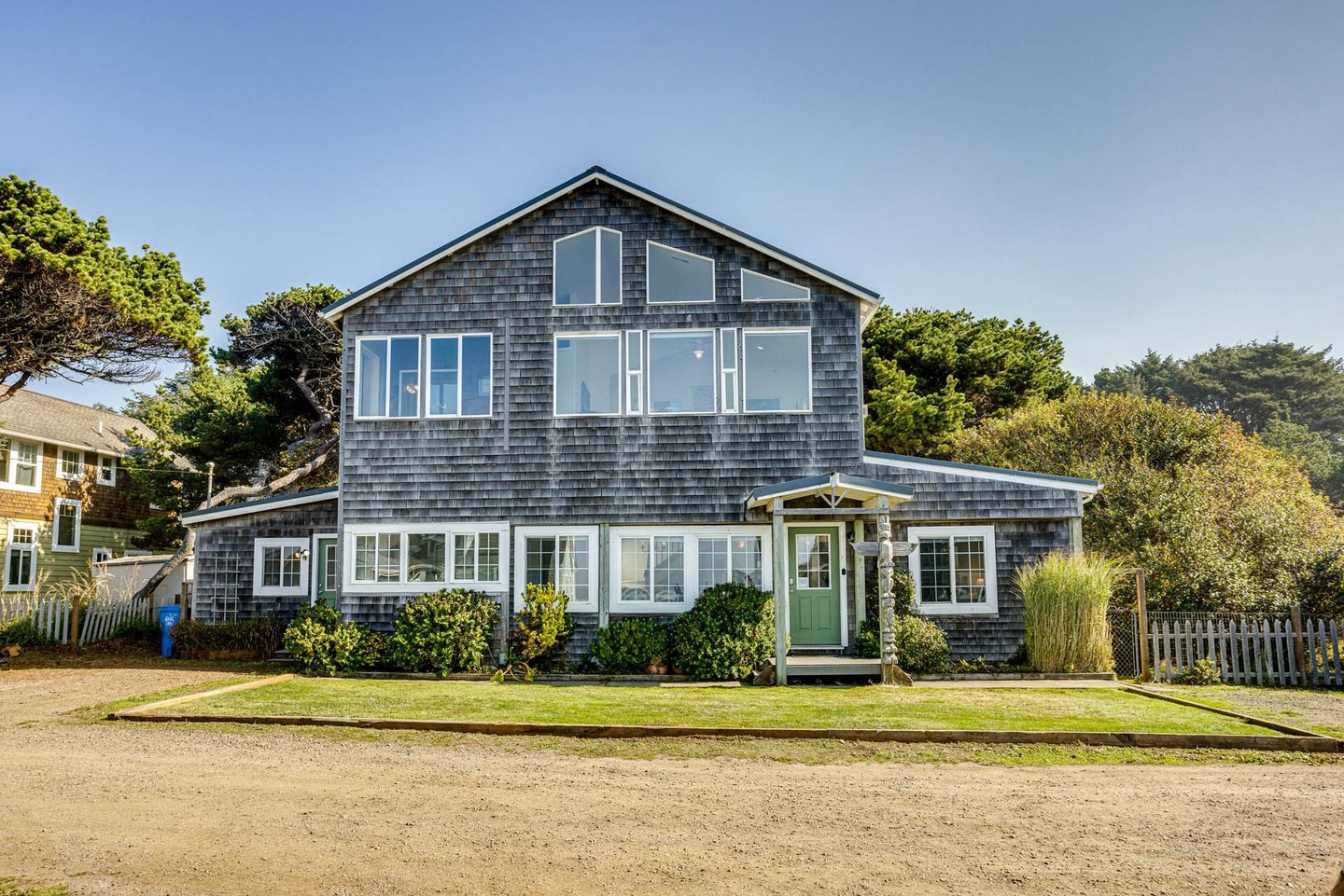 This gorgeous, two story, cedar shingle home is an idyllic ocean-side retreat.