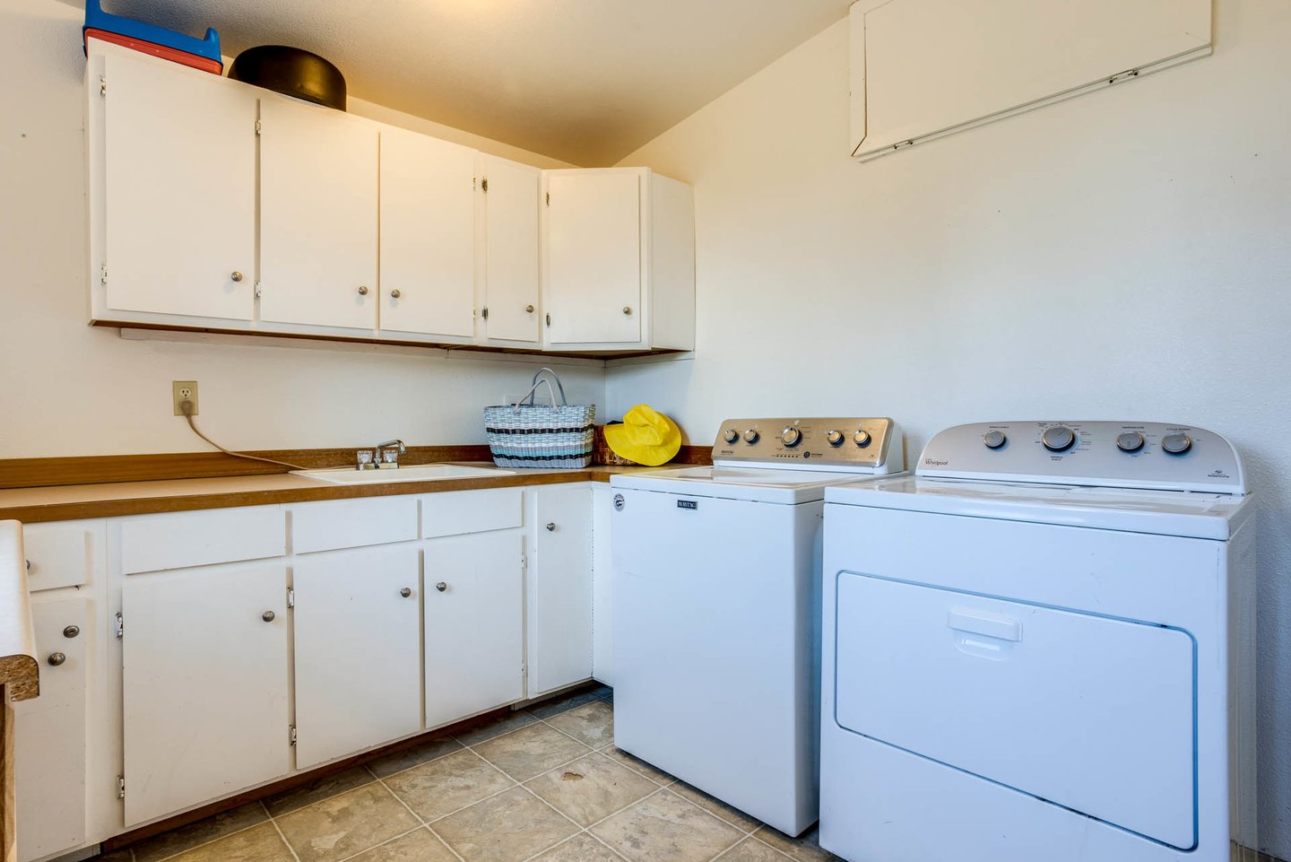 Roomy laundry and mudroom for your convenience