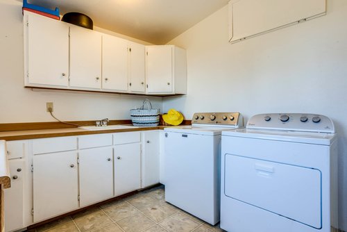 Roomy laundry and mudroom for your convenience