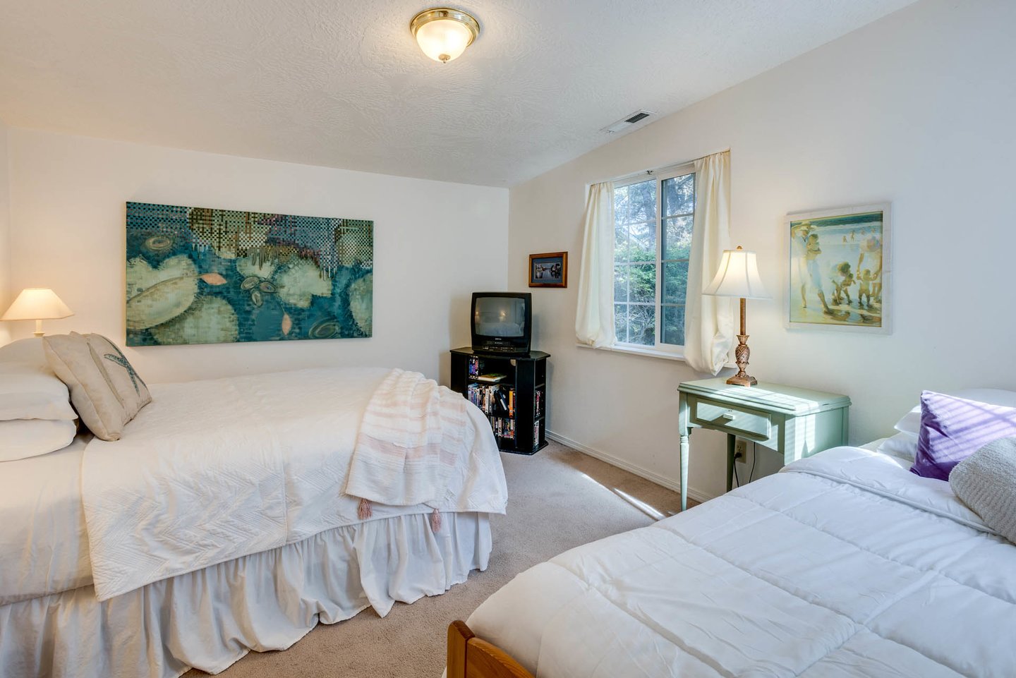 Two bedrooms are on the ground floor of the home, all with crisp, clean, bedding