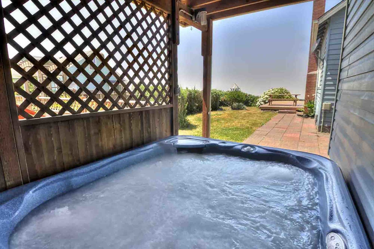 Relax in the hot tub after spending the day beachcombing.