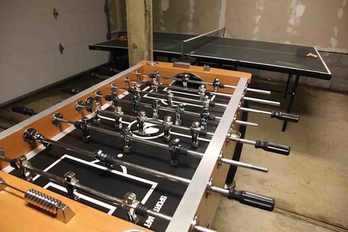 The garage has ping pong and foosball to enjoy.