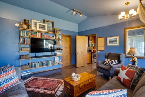 Media room with a Queen sleeper sofa.