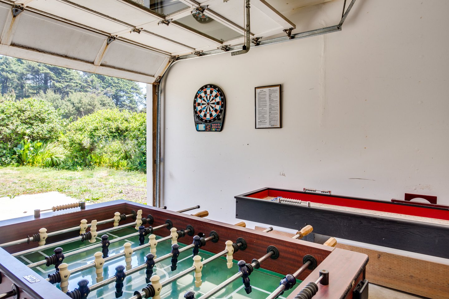 Garage game room with Foosball & shuffleboard.