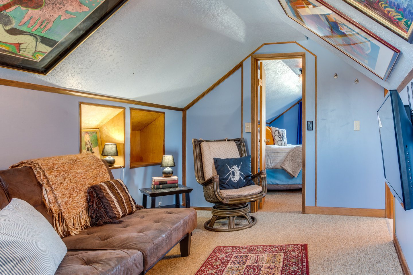 Relax in this art filled media room.