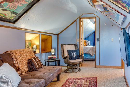 Relax in this art filled media room.