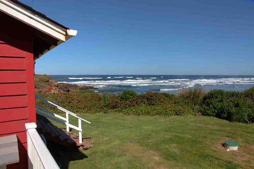 Steps to the backyard and trail to the beach.
