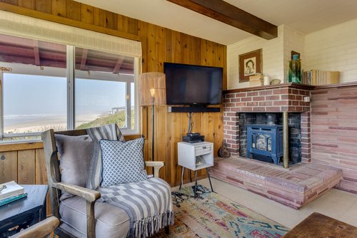 Living area warmed by sunlight and a gas fireplace