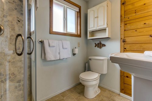Bath with walk in shower.