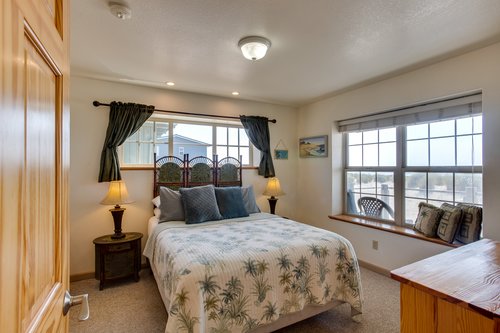 Snuggle up in the upstairs bedroom with queen bed.