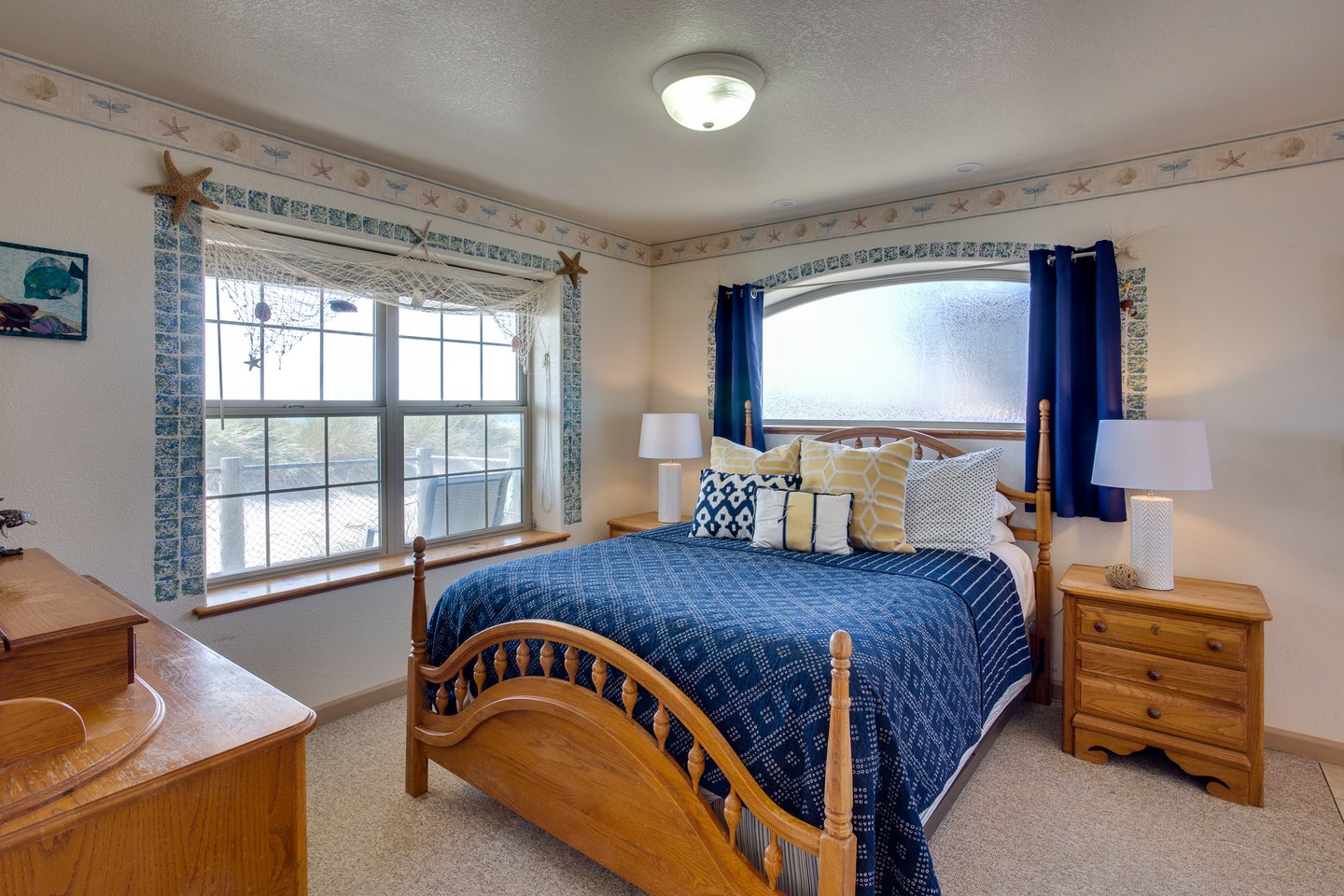 Comfortable bedroom with a queen bed and primary bath ensuite.