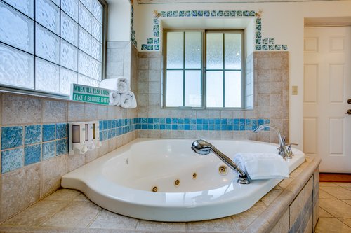 Relax in the jacuzzi tub in the primary bath ensuite.
