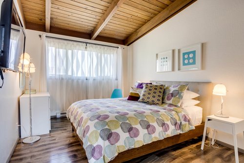 Main floor bedroom with a king bed.