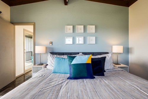 Modern comfort, king bed with bay bridge views.