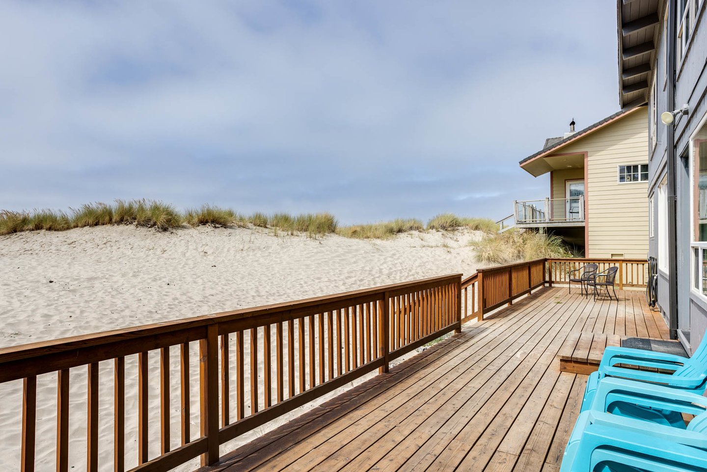 Hang out on the deck and watch the kids play in the sand.