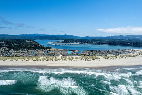 Pacific Chart House sits on Alsea Spit with miles of soft sandy beach.