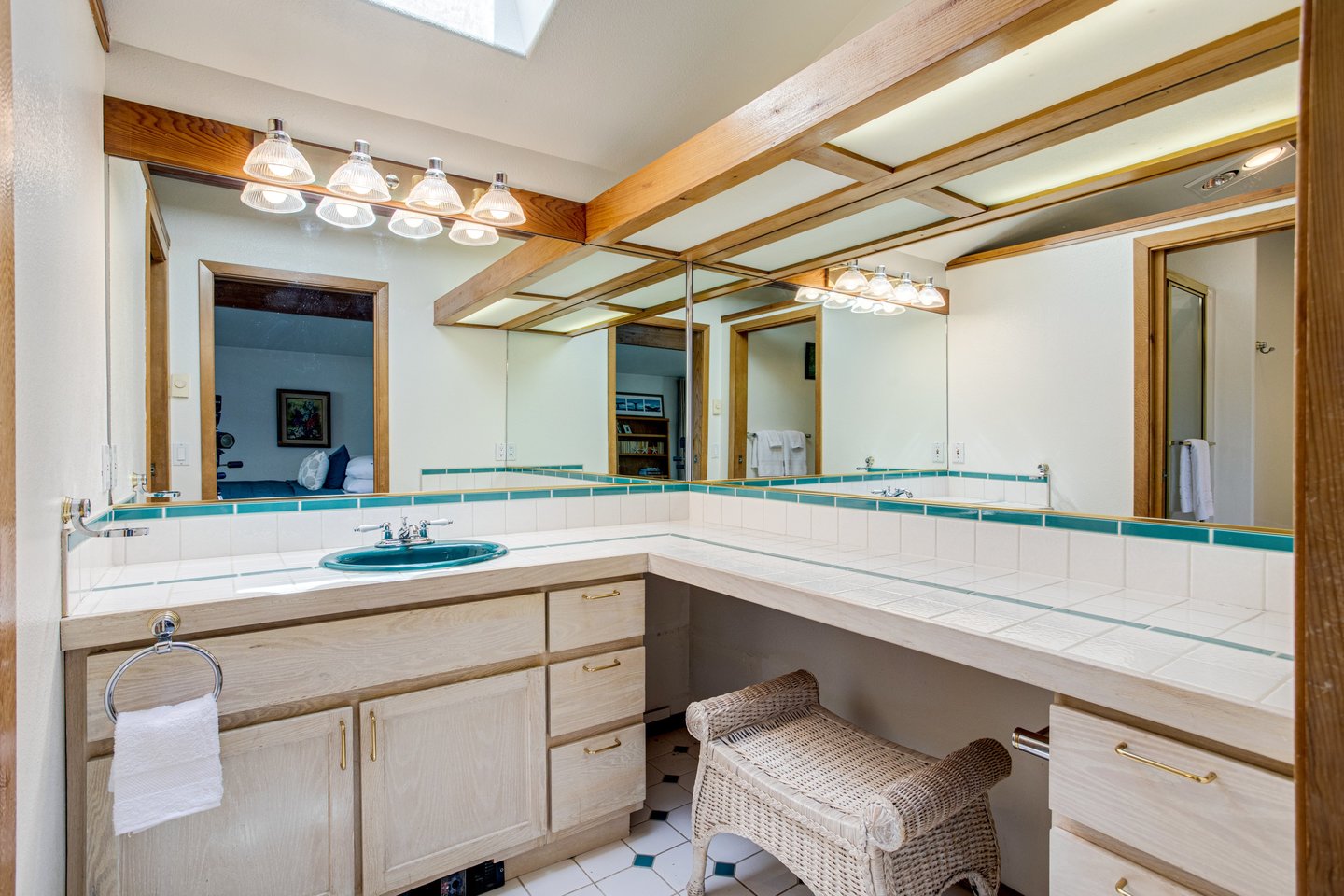 Bright master bathroom with a large vanity.