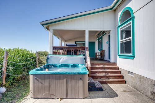 Just off the deck is your own hot tub to relax in.