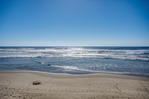 Enjoy the waves and the sunsets from this ocean front home.