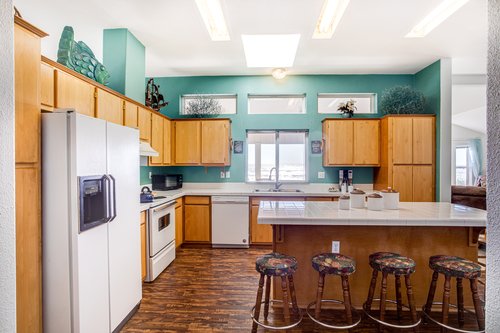 Sit and keep each other company at the kitchen island.