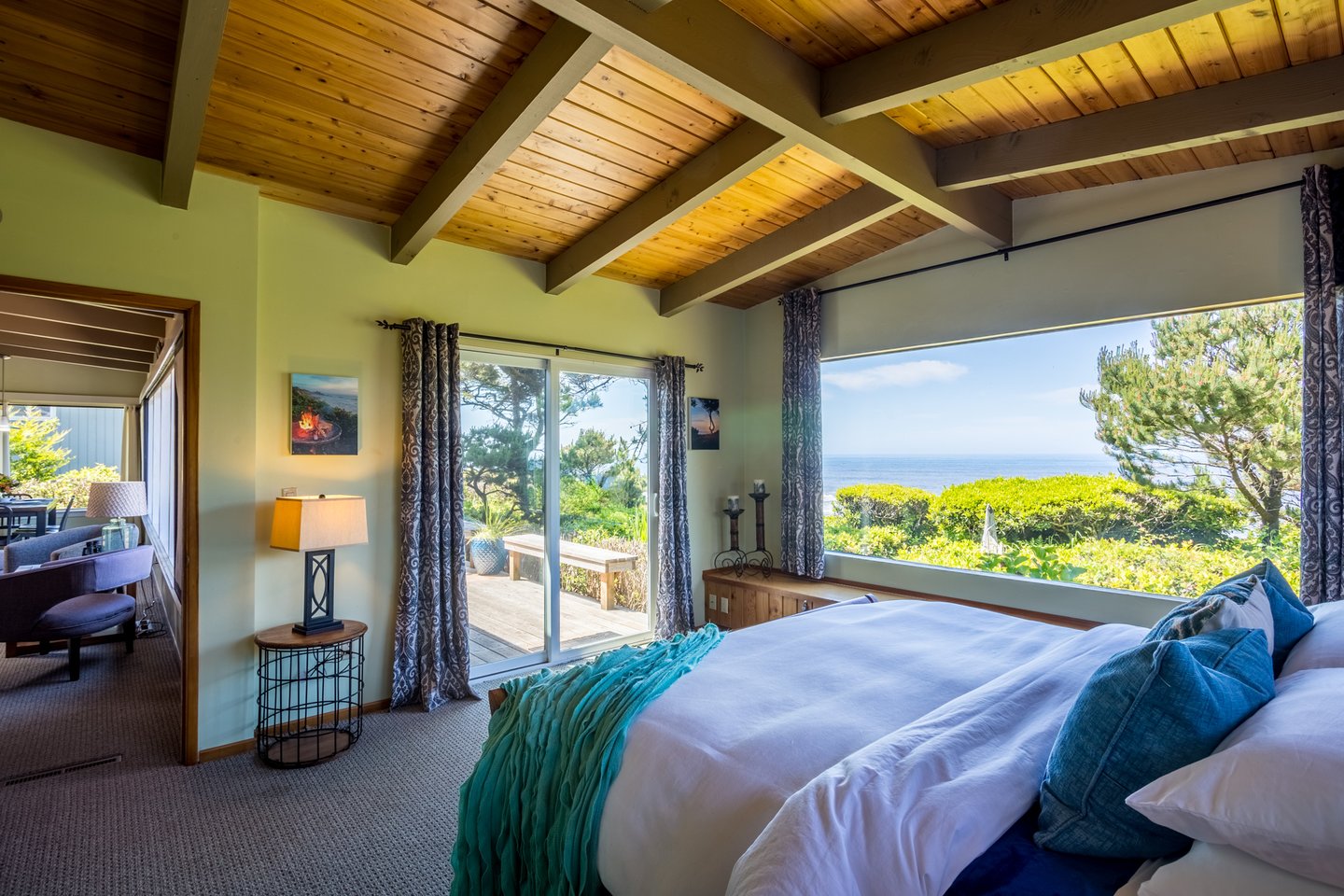 Unparalleled views and sliding glass to the deck in the primary bedroom.
