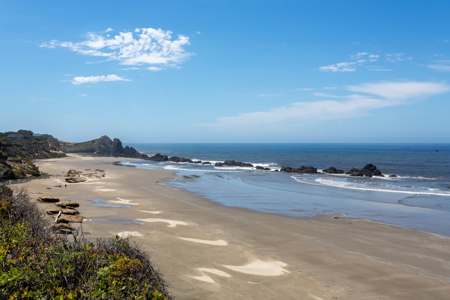 Sandy beach with the additional beauty and interest of rock outcroppings