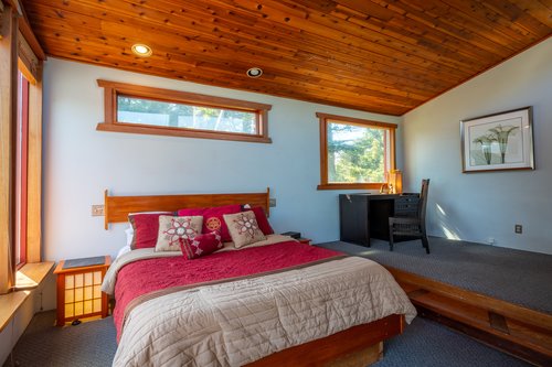Queen bed waits for you in the primary bedroom.