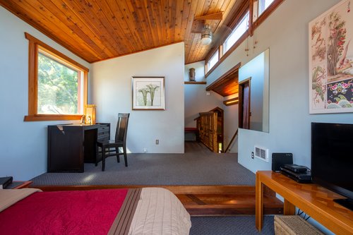 Relax in bed while watching TV or get some work done with a view.